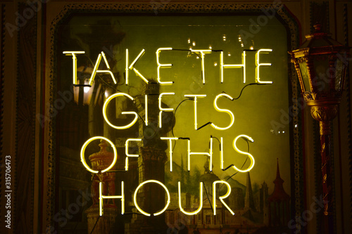 TAKE THE GIFT OF THIS HOUR Neon Sign Board Miami, FL, USA - MIA