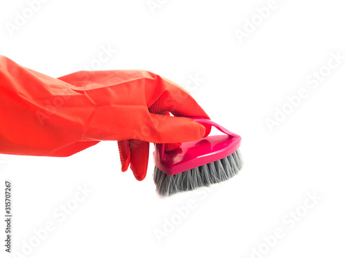 Rubber gloves and a cleaning brush isolated on white background. Set of rubber gloves and brushes. Composition of protective gloves and cleaning brushes.