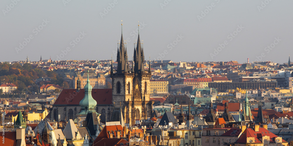 Prague - The panorama of Town and the church of Our Lady before Týn in the evening light.