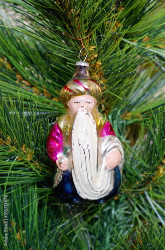 Fairy-tale character Old man Hottabych - old Christmas tree toy on the Christmas tree photo