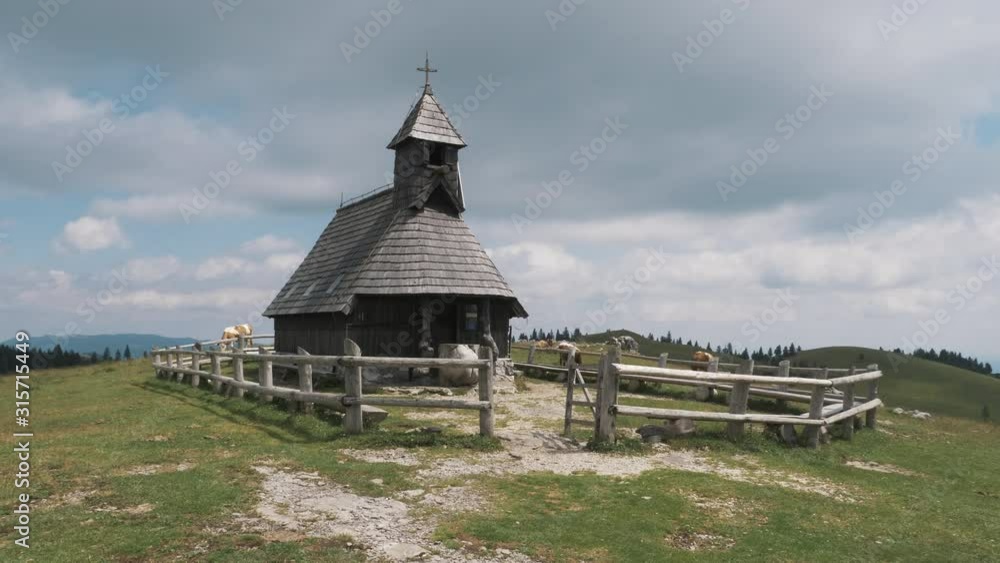 Nice wooden church in a mountain village in Slovenia Nice wooden church in a mountain village in Slovenia