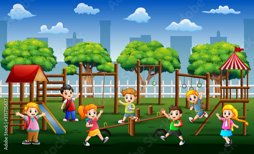 Happy school children playing in public park