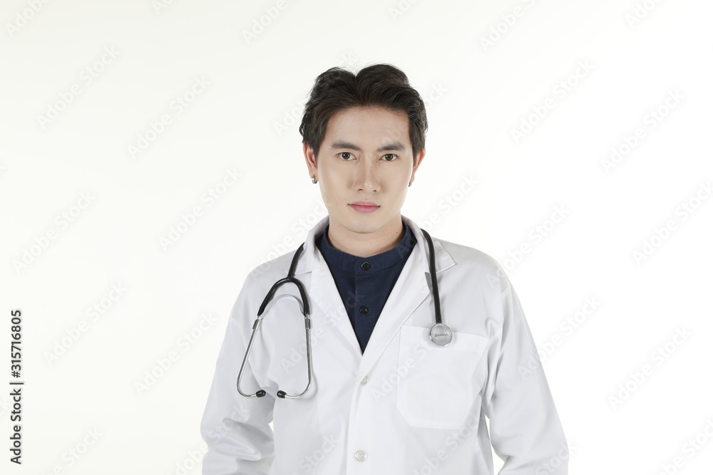 the young asian medical doctor and his stethoscope at isolated white background copy space the young asian medical doctor and his stethoscope at isolated white background copy space