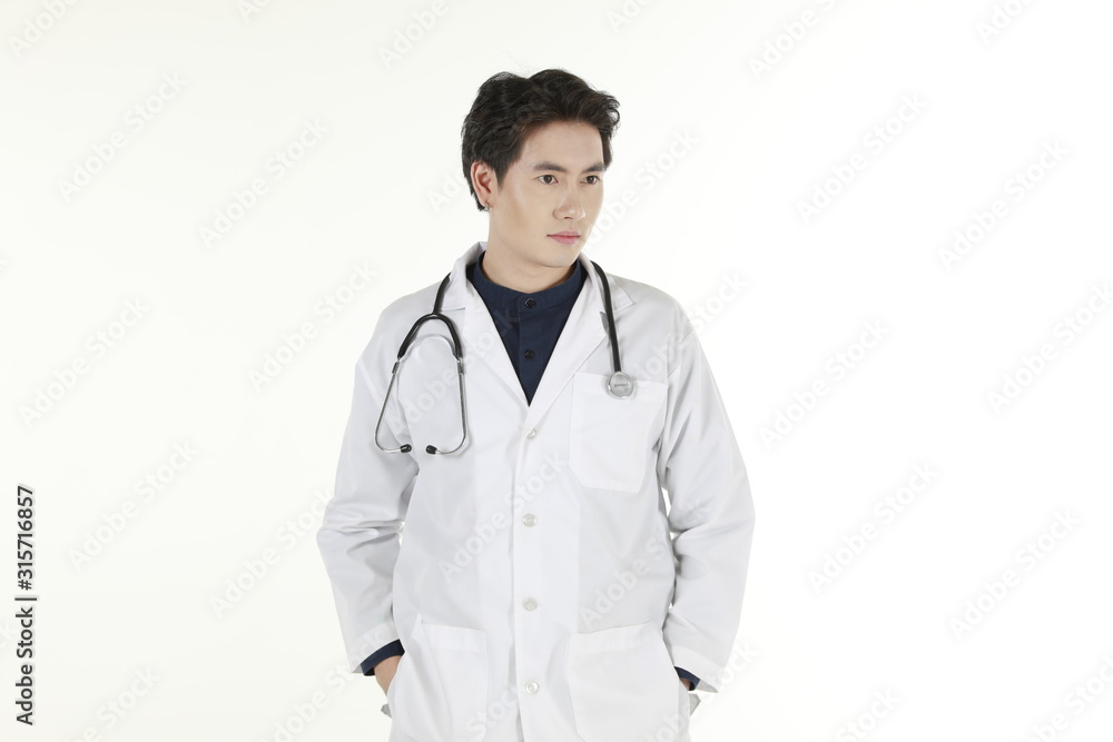 the young asian medical doctor and his stethoscope at isolated white background copy space the young asian medical doctor and his stethoscope at isolated white background copy space