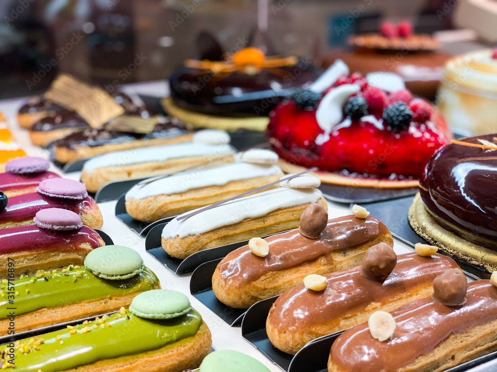 tasty french eclairs with fresh fruits