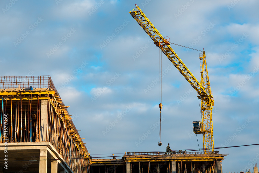 Building construction house with crane concept. Blue sky background.