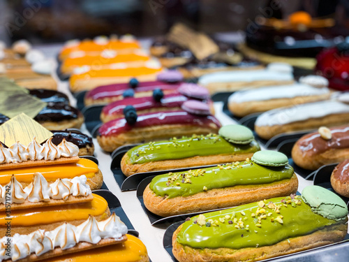 tasty french eclairs with fresh fruits