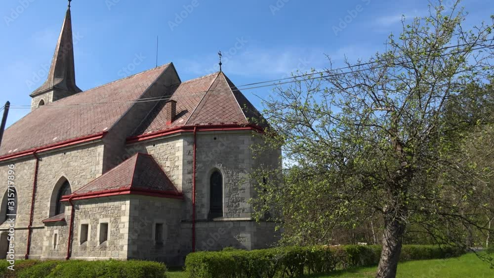 A beautiful historic, old church set in nature, on a bright day. A beautiful historic, old church set in nature, on a bright day.