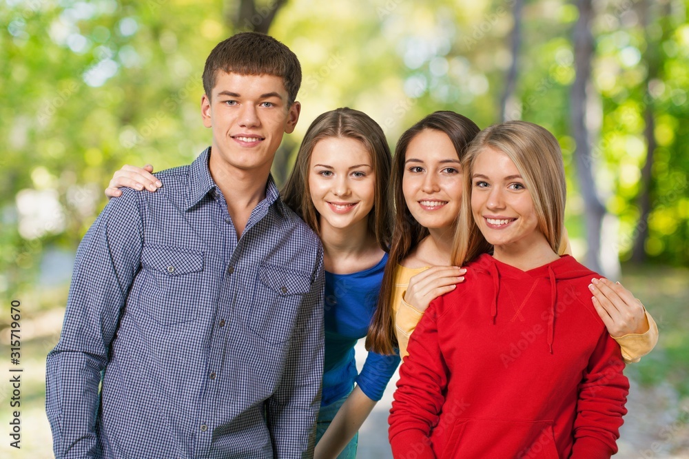 Young group smile students on a natural background Young group smile students on a natural background