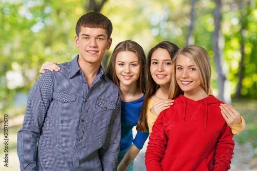 Young group smile students on a natural background