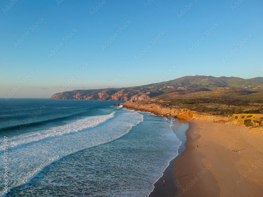 Aerial view from a beach at the sunset. Guincho beach in Cascais Portugal