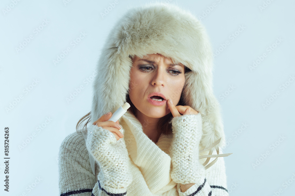 woman using hygienic lipstick concerned with lip condition woman using hygienic lipstick concerned with lip condition