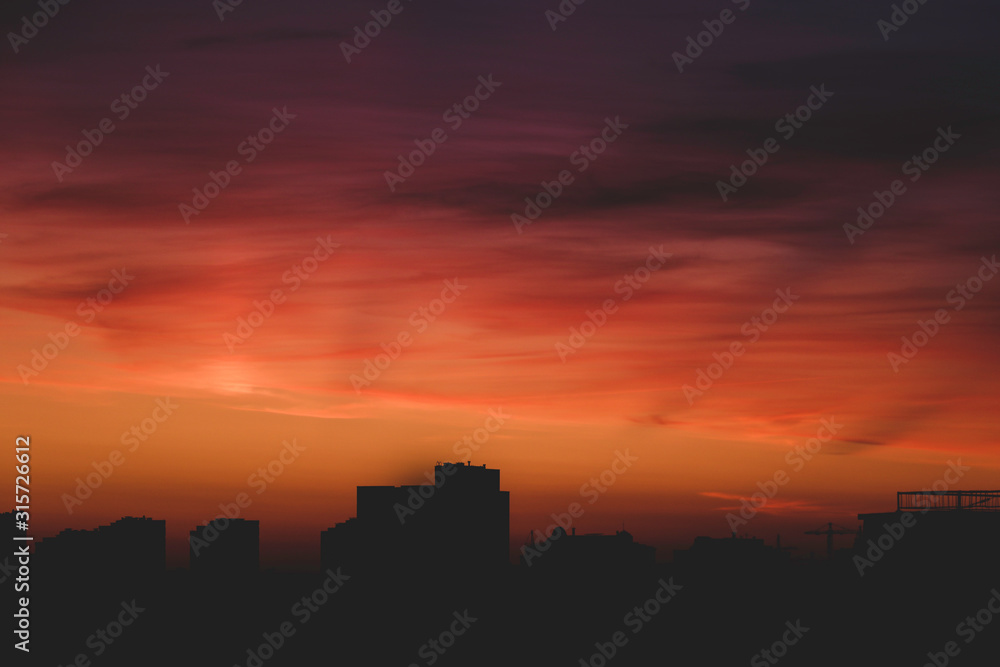 Sunrise over city with cloudy sky, nature