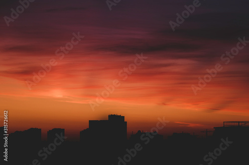 Sunrise over city with cloudy sky, nature