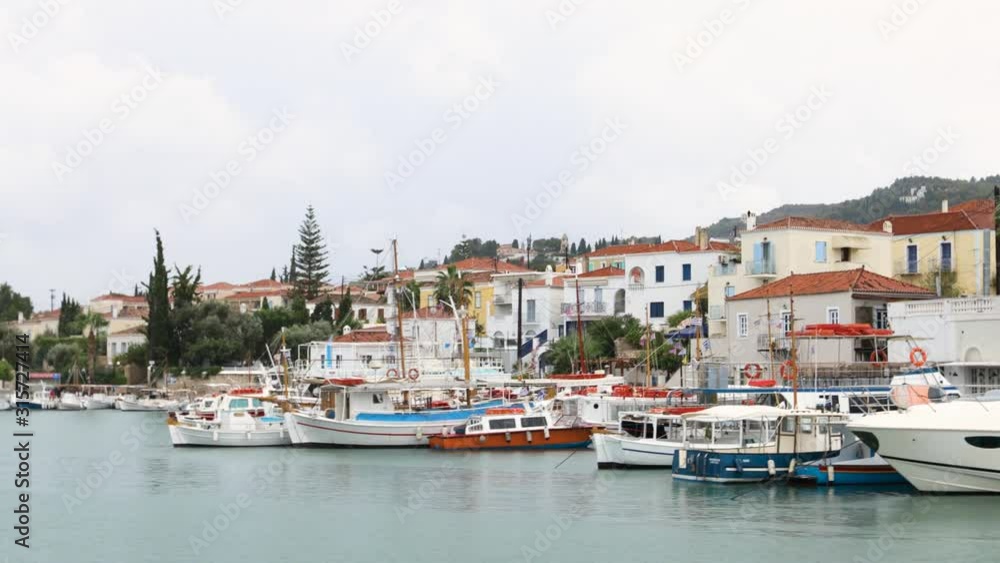 Entering in Spetses. Yacht sails in the harbor. Entering in Spetses. Yacht sails in the harbor.