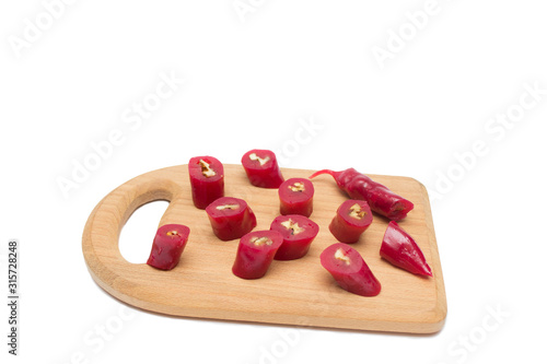 Churchkhela cut into pieces on a wooden board isolated, Georgian national sweet photo