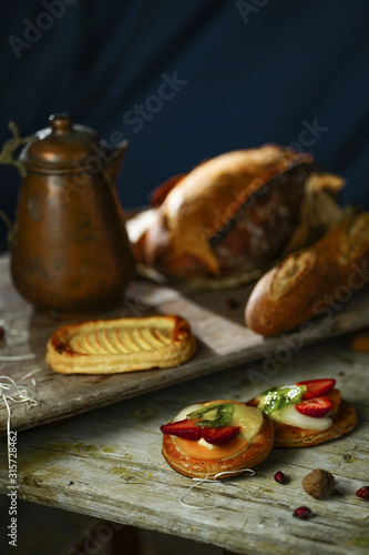 Bread on a wooden background in the rustic style