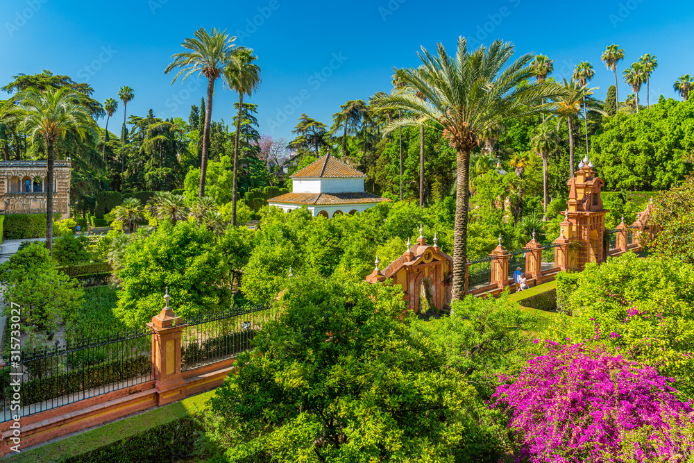 The idyllic garden in the Royal Alcazars of Seville, Andalusia, Spain. 