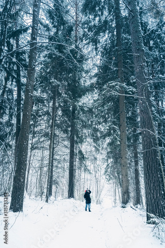 Travel photographer takes pictures in snow forest © kovaleva_ka