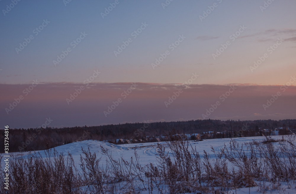 nature winter background . Winter  village landscape at sunset.