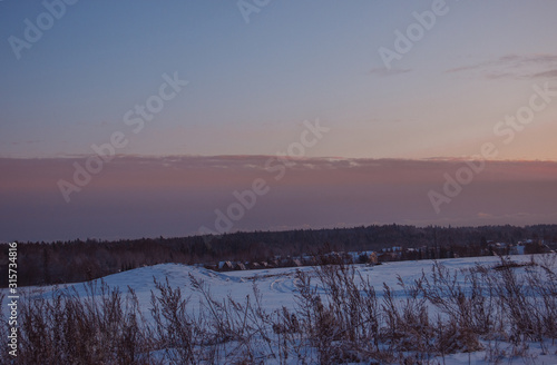 nature winter background . Winter village landscape at sunset.
