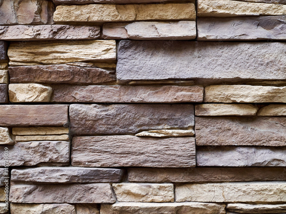 Close-up wall of stone slabs and blocks Close-up wall of stone slabs and blocks