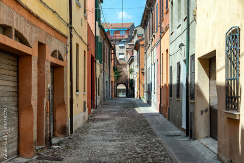 Narrow medieval street in Ferrara  Italy
