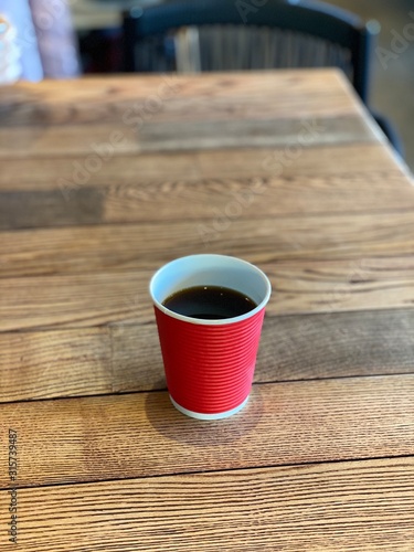 coffee in a red paper cup