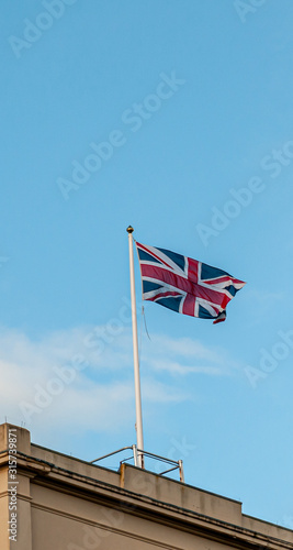 Union flag flying against a blue sky