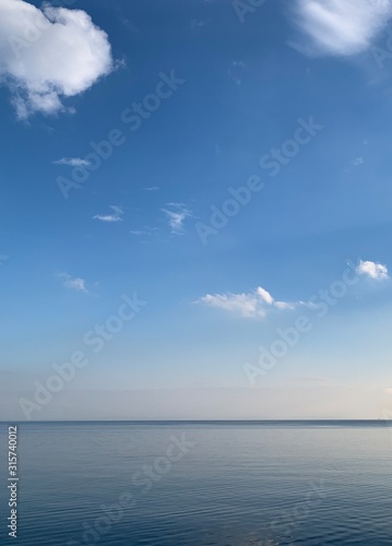 Amazing blue sky reflection on the sea water background
