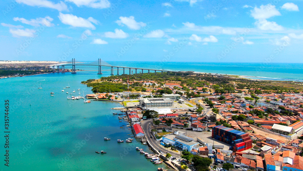 Suspension Bridge in Natal, Brazil and colorful blue water of Atlantic ocean. 