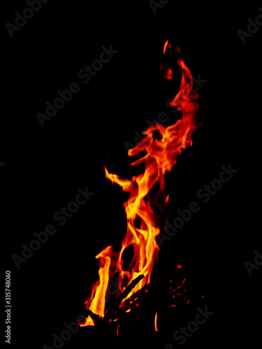 Fire against black background. Abstract nature wallpaper.