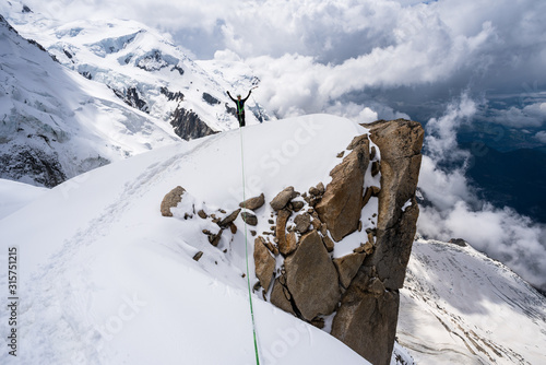Bild auf Leinwand Mountaineer on a ridge