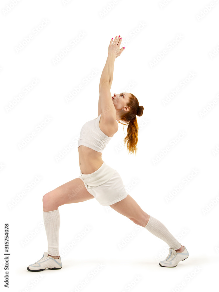 Young woman is engaged in fitness and yoga. Studio shot on white background.