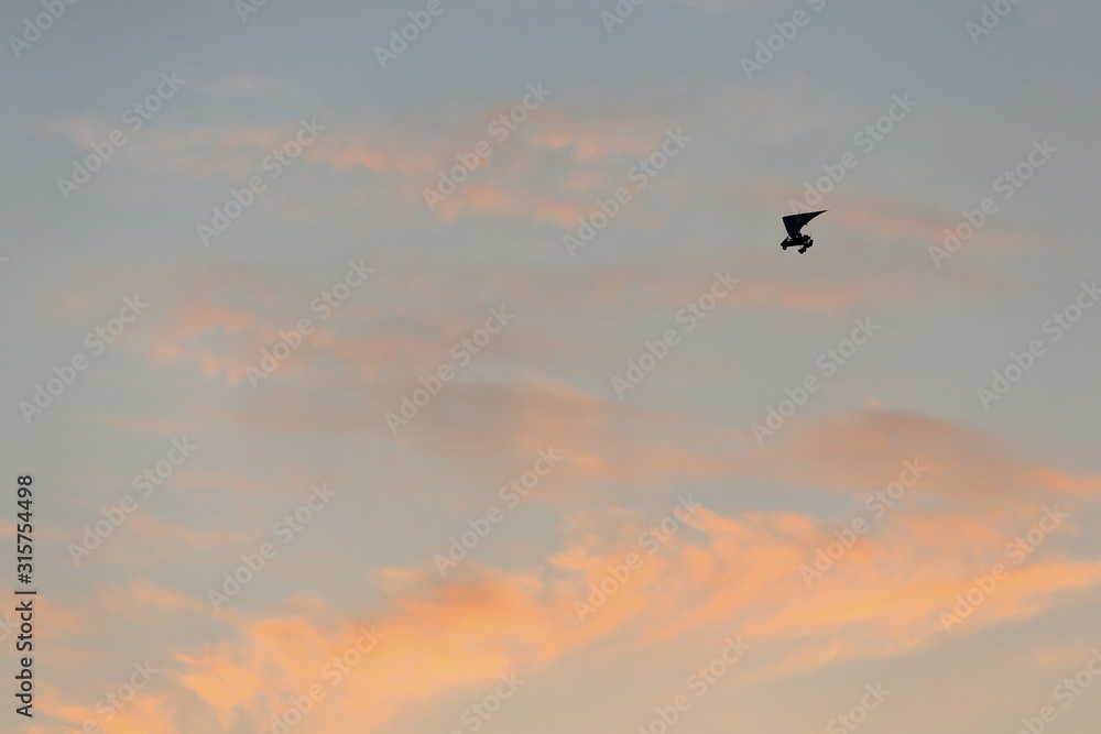 Ultralight plane-sunset blue sky with some clouds. Dunhunag Crescent Lake-Gansu-China-0688 Ultralight plane-sunset blue sky with some clouds. Dunhunag Crescent Lake-Gansu-China-0688