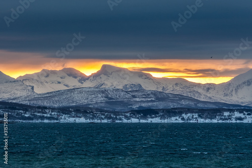 beautiful sunset under blue hour over fjord in Lofoten islands, Norway.