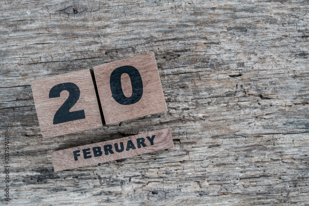 cube calendar for february on wooden background with copy space cube calendar for february on wooden background with copy space