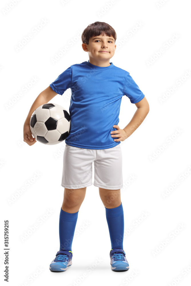 Boy in sports jersey holding a soccer ball and posing