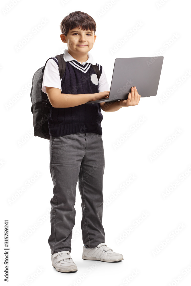 Schoolboy in a uniform holding a laptop computer Schoolboy in a uniform holding a laptop computer
