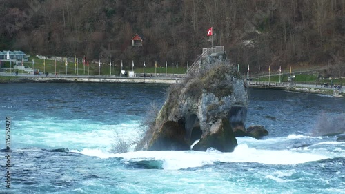 Waterfall on the river Rhine in the Swiss canton of Schaffhausen in Switzerland in winter photo