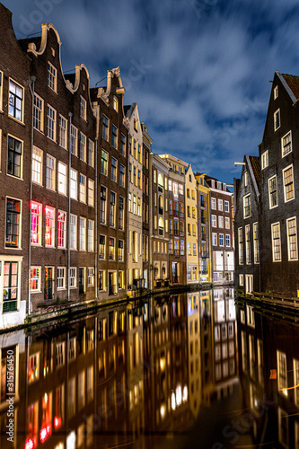 Photography Amsterdam canals and houses against night cityscape of Amsterdam, Holland Nether