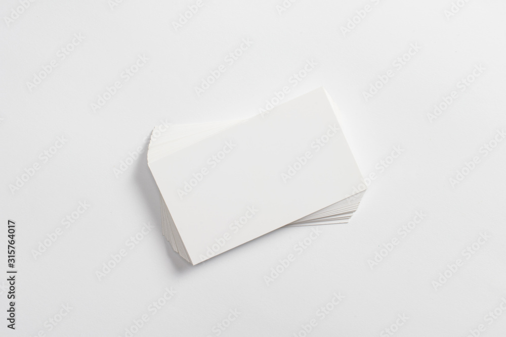 Top view of blank business cards isolated on white background Top view of blank business cards isolated on white background