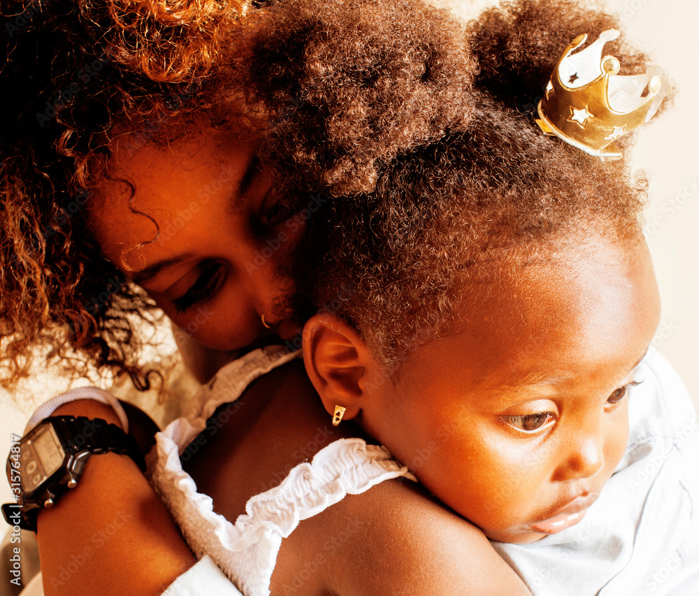 adorable sweet young afro-american mother with cute little daughter, hanging at home, having fun playing smiling, lifestyle people concept, queen girl - obrazy, fototapety, plakaty 