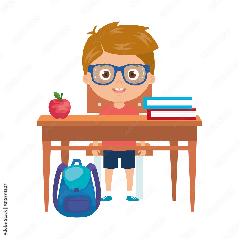 student boy sitting in school desk on white background