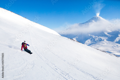 snowboarder on mountain slope