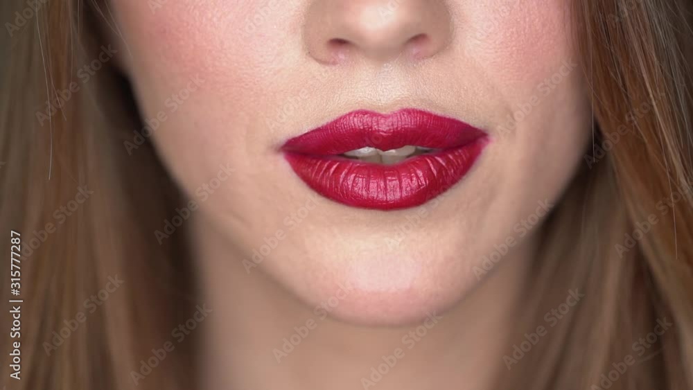 woman with red lips kissing. Lipstick. close-up