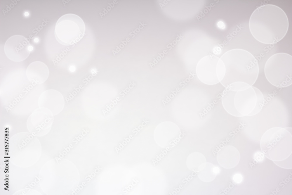 Defocused lights over silver background Defocused lights over silver background