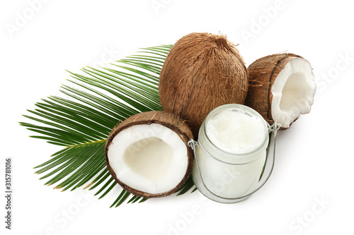 Composition with organic coconut oil on white background. Healthy cooking