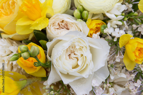 Floral backdrop  background. Flowers in bloom. White yellow bouquet with peonies roses close-up  details