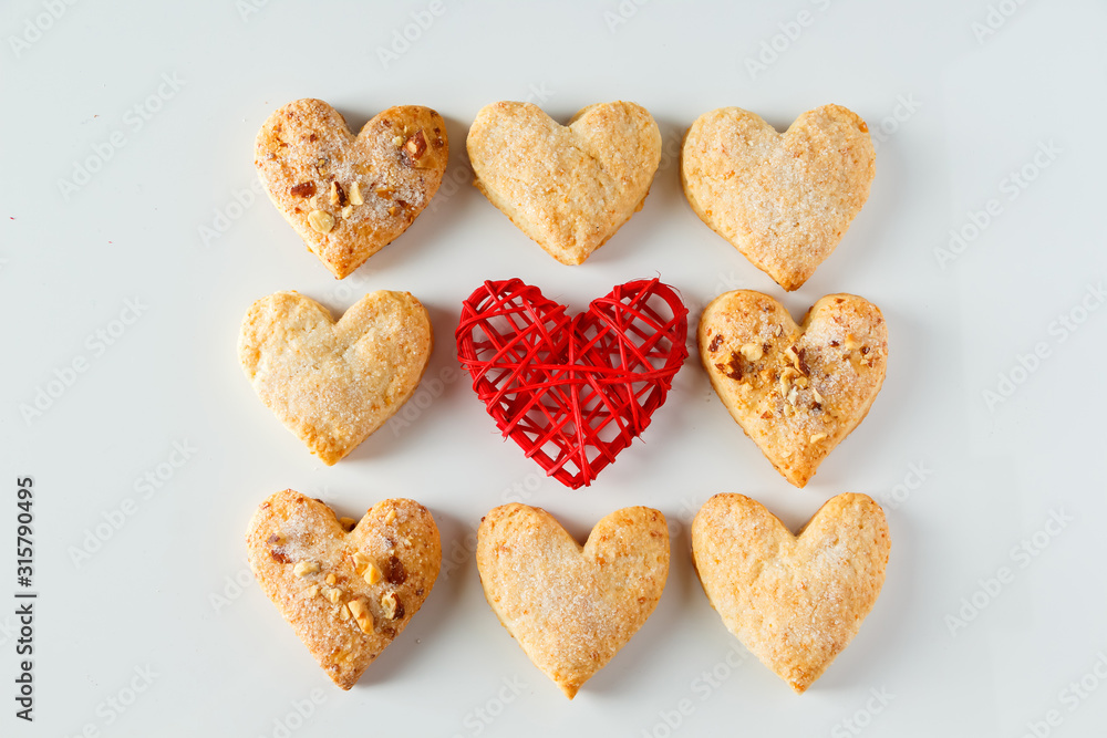 Fototapeta premium Heart shaped cookie pattern on a white background